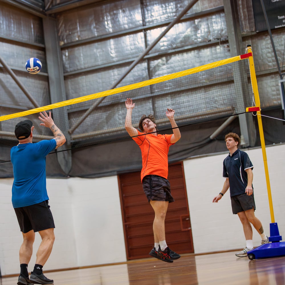 HART Big Blue Base Multi Sport System volleyball net and posts set with blue base and sturdy construction for outdoor sports.