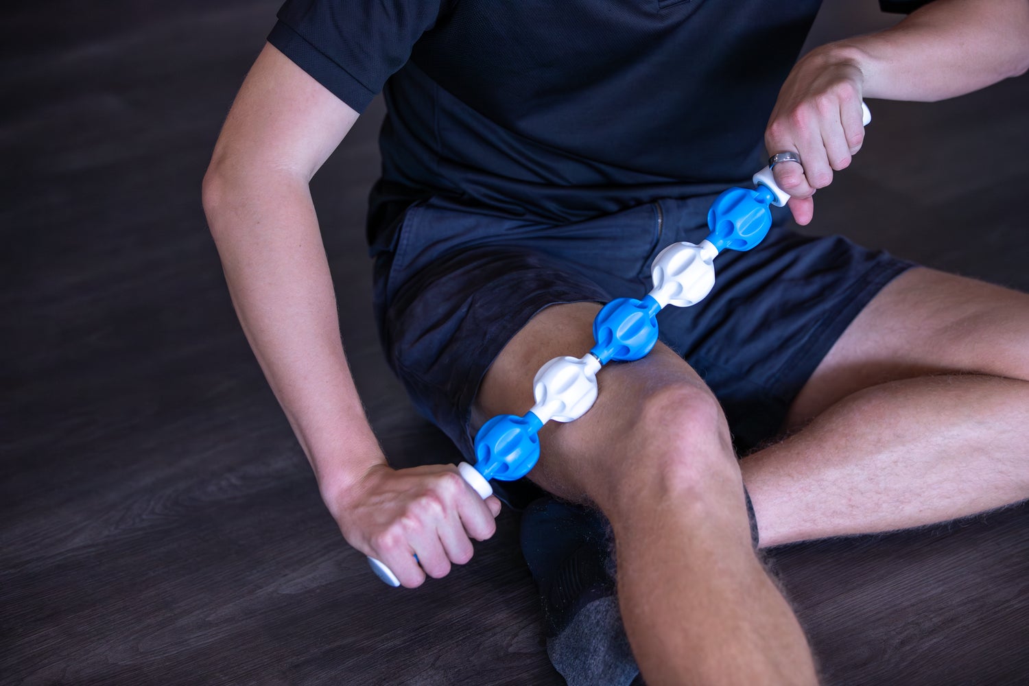HART Massage Roller Stick with textured surface for muscle relief and recovery, handheld fitness and massage tool.