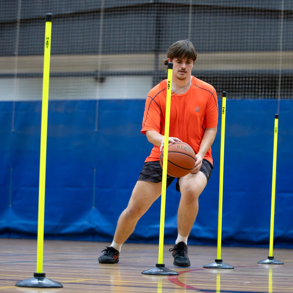HART Safety Agility Pole Set with multiple colorful poles for agility training and obstacle courses.