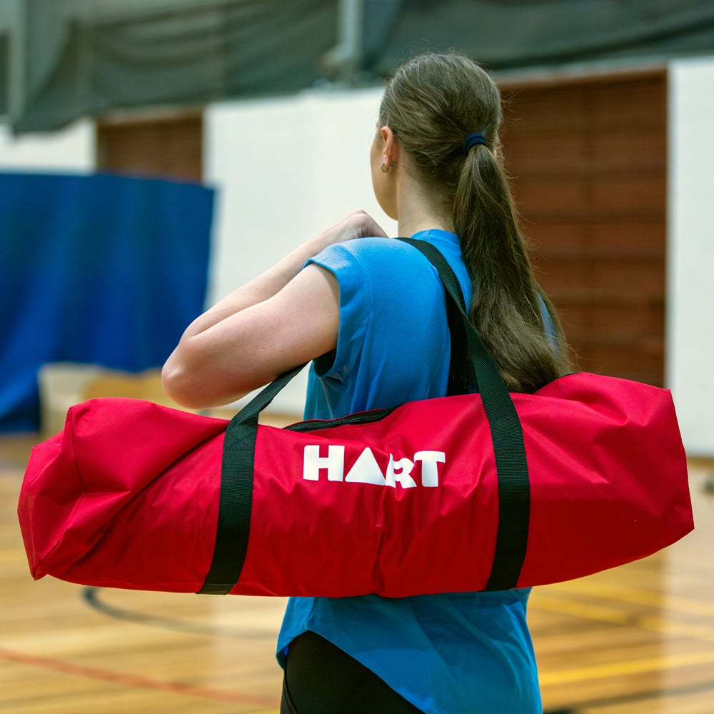 HART Sport rolling badminton net system with posts, lightweight design, and adjustable net height for easy setup and storage.