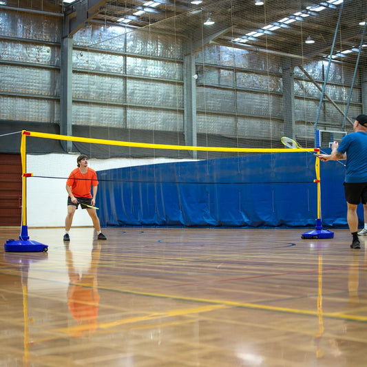 HART Big Blue Base Multi Sport System with volleyball net and posts, outdoor sports equipment for versatile play.