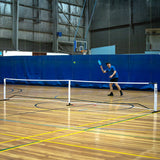 HART 2-in-1 pickleball and tennis net set with adjustable height poles, suitable for outdoor sports and recreational play.