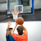 HART Atomic basketball with orange and black design, standard size, rubber exterior, suitable for indoor and outdoor play.