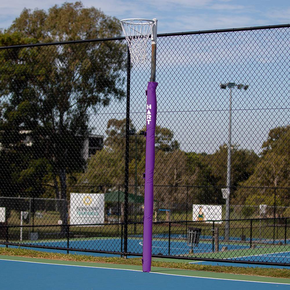 Pair of HART flat netball post pads in white, 25mm thick, designed for secure attachment to netball posts.