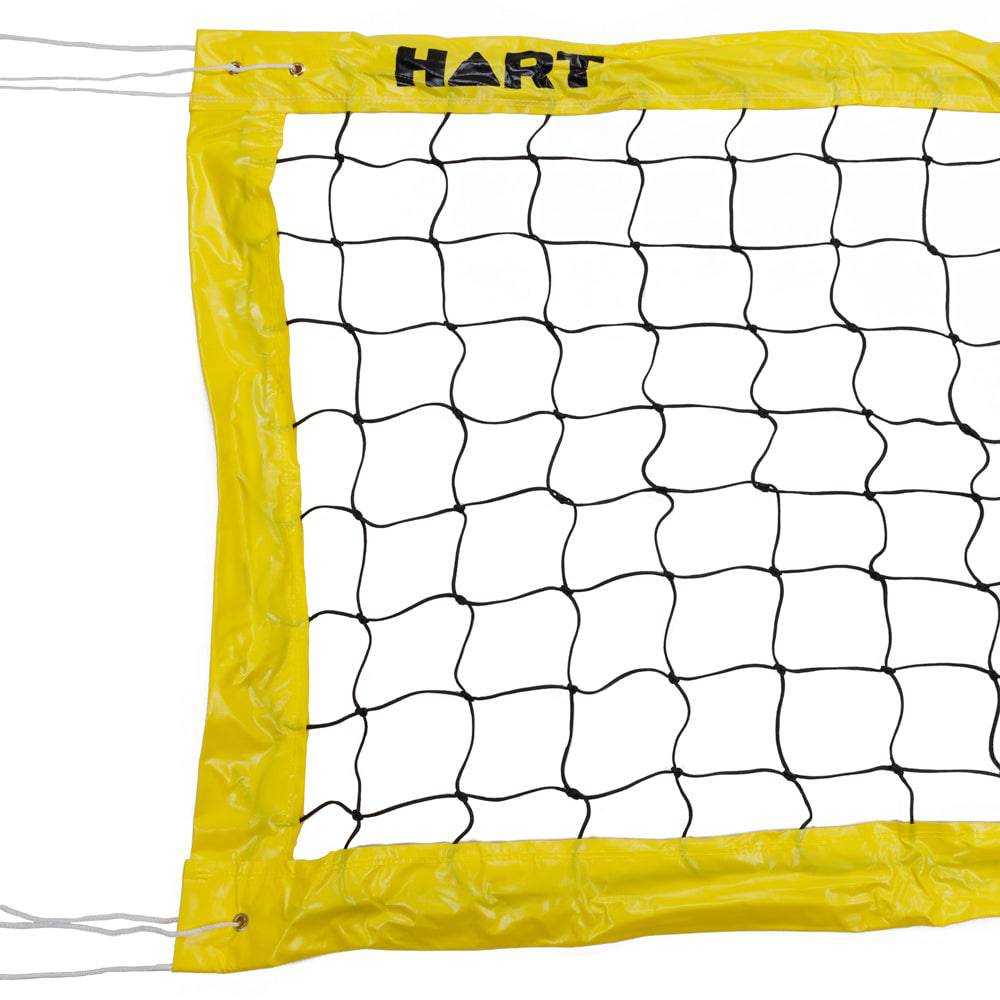 HART beach volleyball net set up on sand, with the net and poles visible for outdoor beach volleyball games.