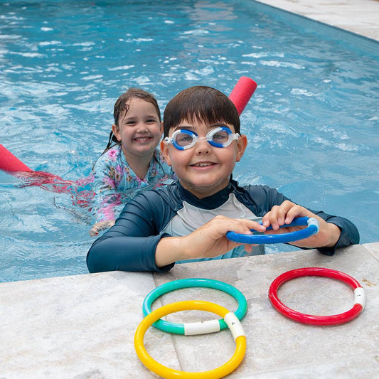 Bright neon junior swim goggles by HART with adjustable straps and clear lenses for comfortable swimming.