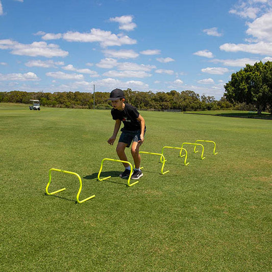 Set of six HART Step Hurdles, 15cm high, arranged in a row for athletic training and agility exercises.